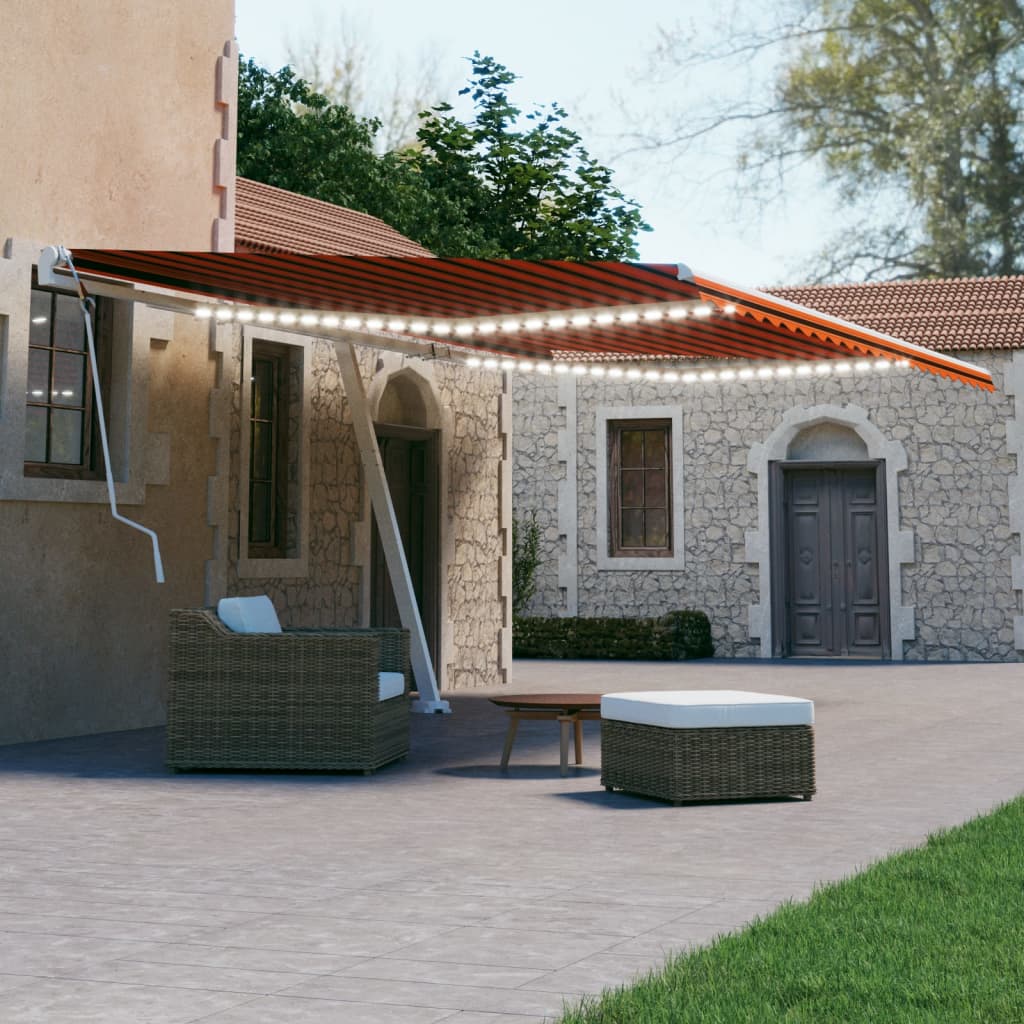 Berkfield Manual Retractable Awning with LED 600x300 cm Orange and Brown