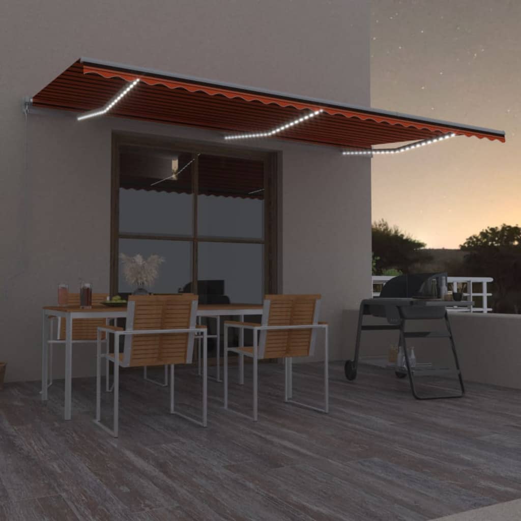 Berkfield Manual Retractable Awning with LED 600x350 cm Orange and Brown