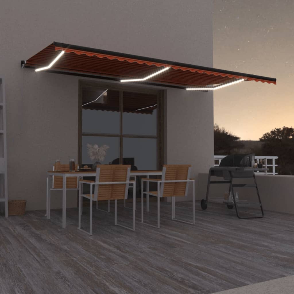 Berkfield Manual Retractable Awning with LED 600x350 cm Orange and Brown